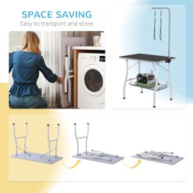 Dog grooming table with adjustable arms, mesh tray, two handles, and rubber surface